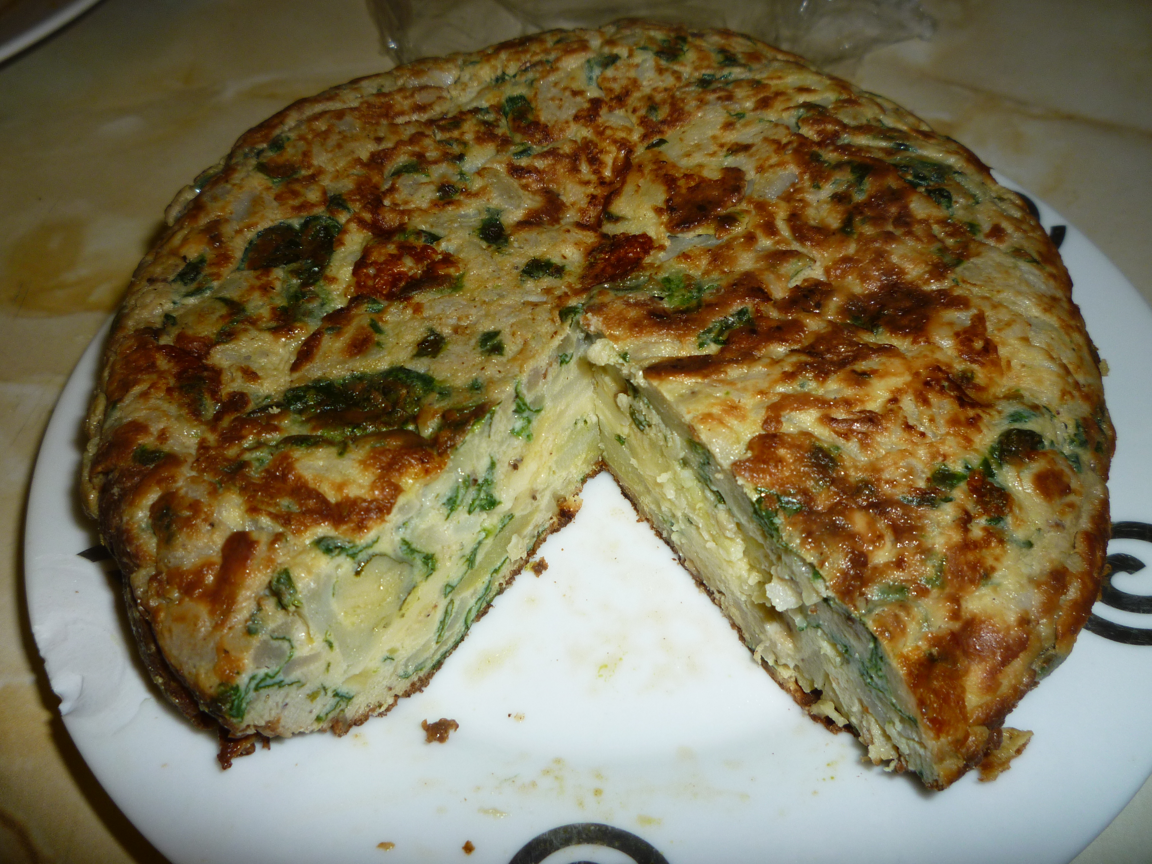 Cooking, Eating. Eating Cooking - Potato omelette with spinach Cooking, Eating. Eating Cooking - Potato omelette with spinach